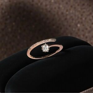 Elegant Rose Gold Spiral Ring with Diamond Accent
